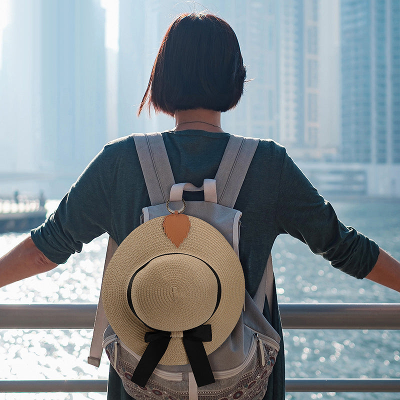 Faux leather magnetic hat clip in brown, perfect travel accessory for hands-free hat carrying.
