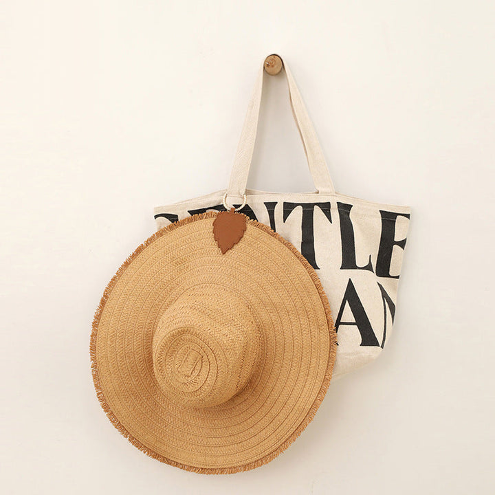 Close-up of a magnetic hat holder clip, showing the secure faux leather design.