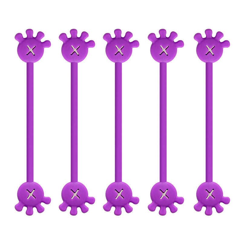 Collection of magnetic silicone cable organizer clips in a clear bowl, ready for home office use.