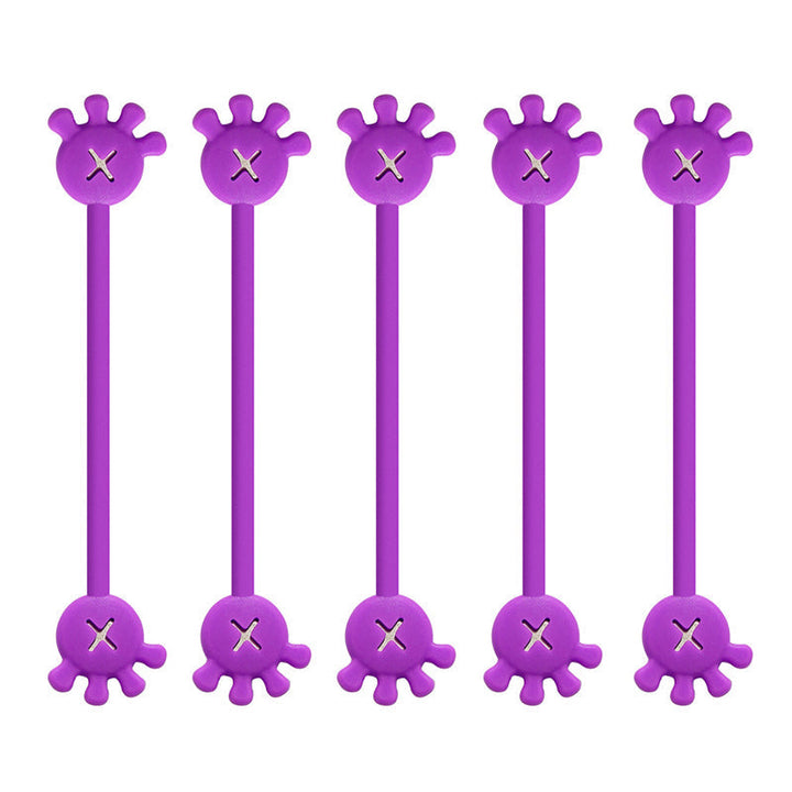 Collection of magnetic silicone cable organizer clips in a clear bowl, ready for home office use.