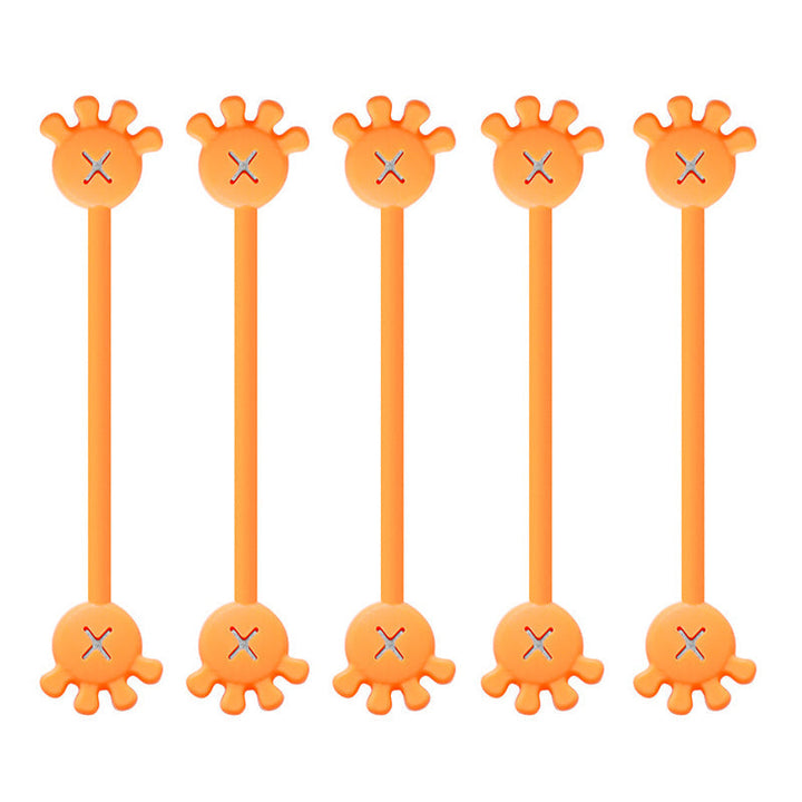 Multiple magnetic silicone cable organizer clips holding various power cords and USB cables neatly.