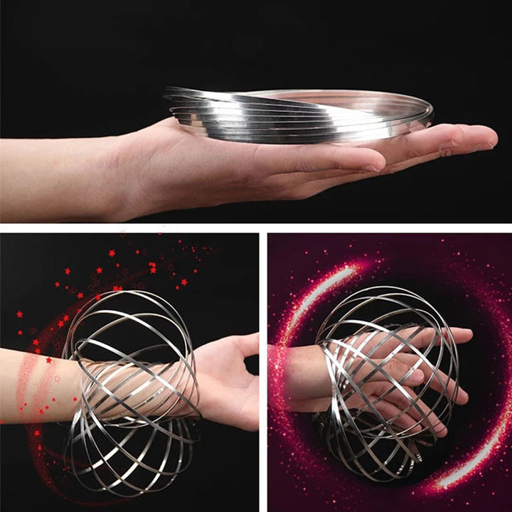 Top-down view of a shiny metal spinning spiral fidget bracelet on a clean surface.