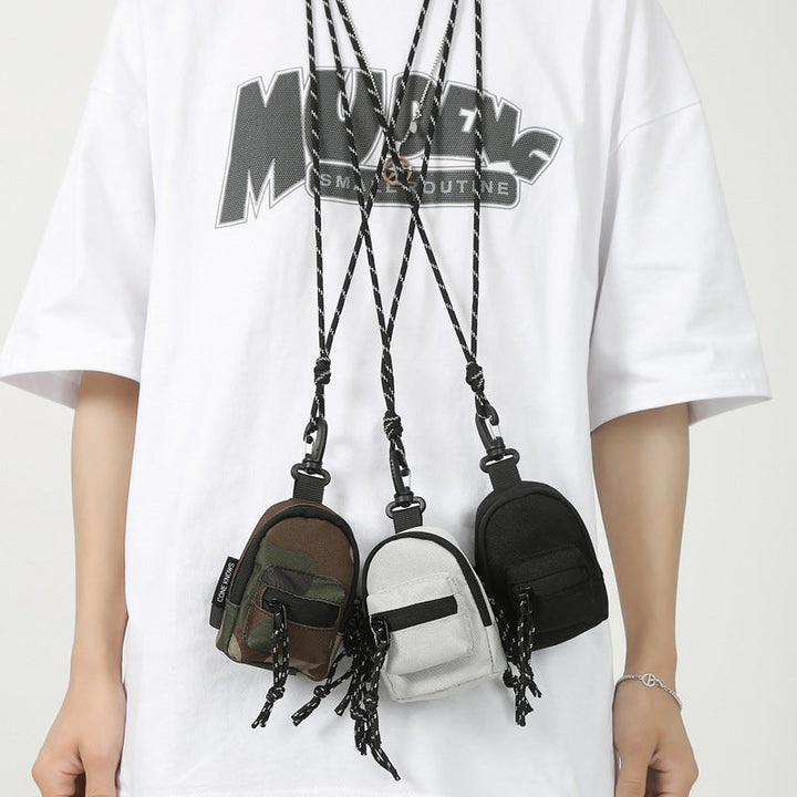 Unisex mini pendant bag in black oxford cloth, perfect for essentials and travel.