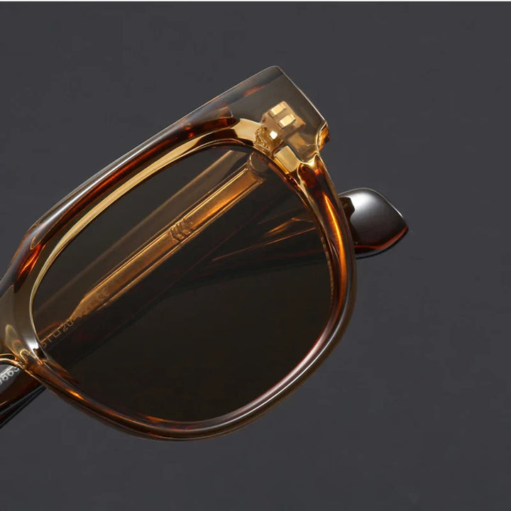 Modern square frame sunglasses for men and women, sleek black finish, angled view