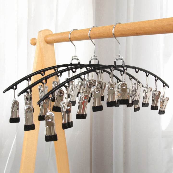 Compact stainless steel hanger, a smart clothing storage accessory for small apartments & tight closets.
