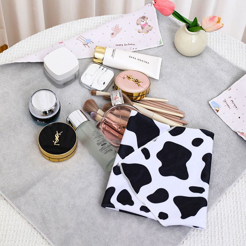 Stylish woven fabric pouch, serves as a cosmetic bag, electronics pouch, or general travel organizer.