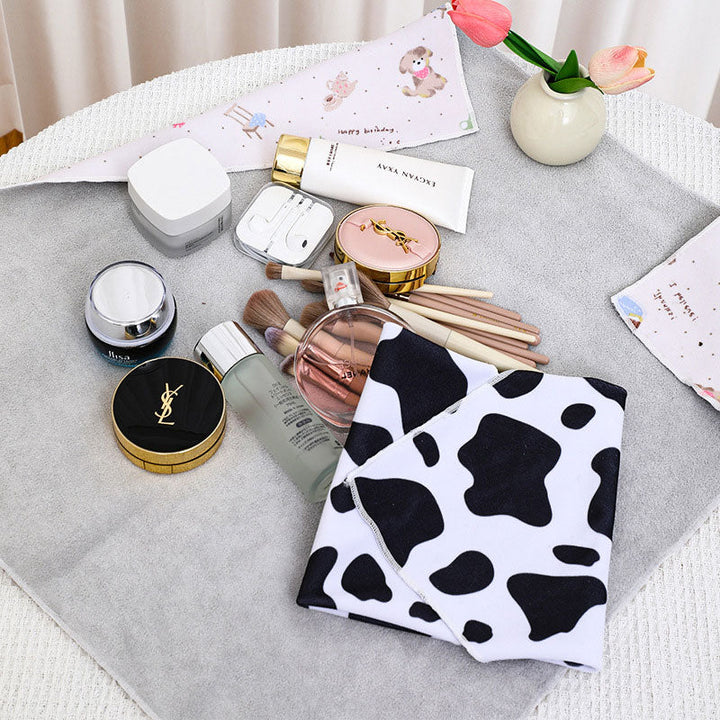 Stylish woven fabric pouch, serves as a cosmetic bag, electronics pouch, or general travel organizer.