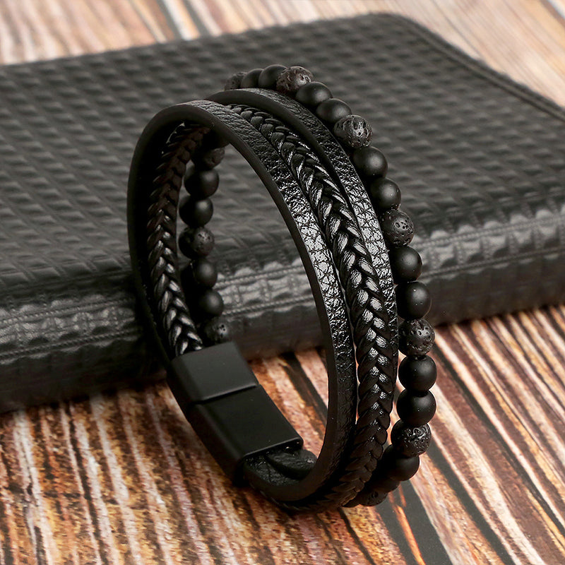 Close-up of natural obsidian beads and magnetic buckle on a healing bracelet, unisex style