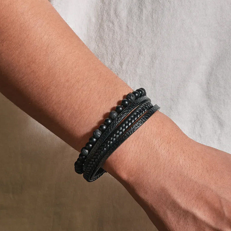Unisex fashion bracelet: polished black obsidian with a secure magnetic clasp, studio shot
