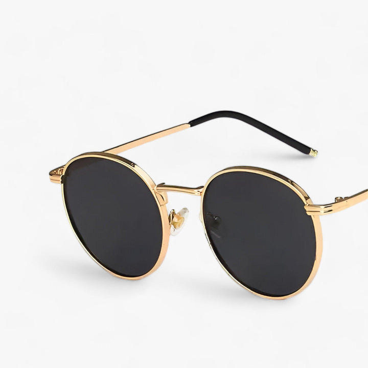 Unisex Nova round lens designer sunglasses. Stylish UV protection eyewear with a modern metal frame.