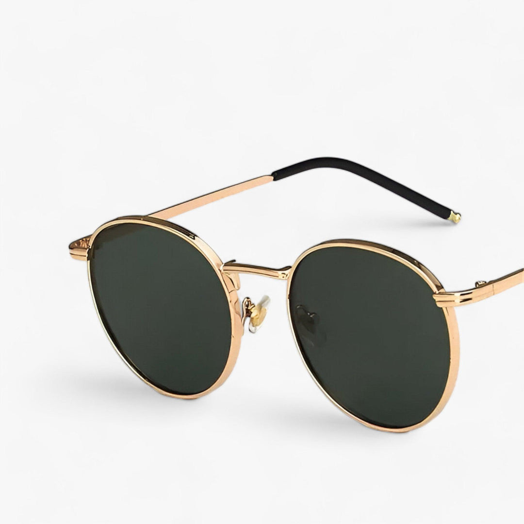 Gray round lens unisex designer sunglasses. Premium eyewear with UV protection and a sleek metal frame.