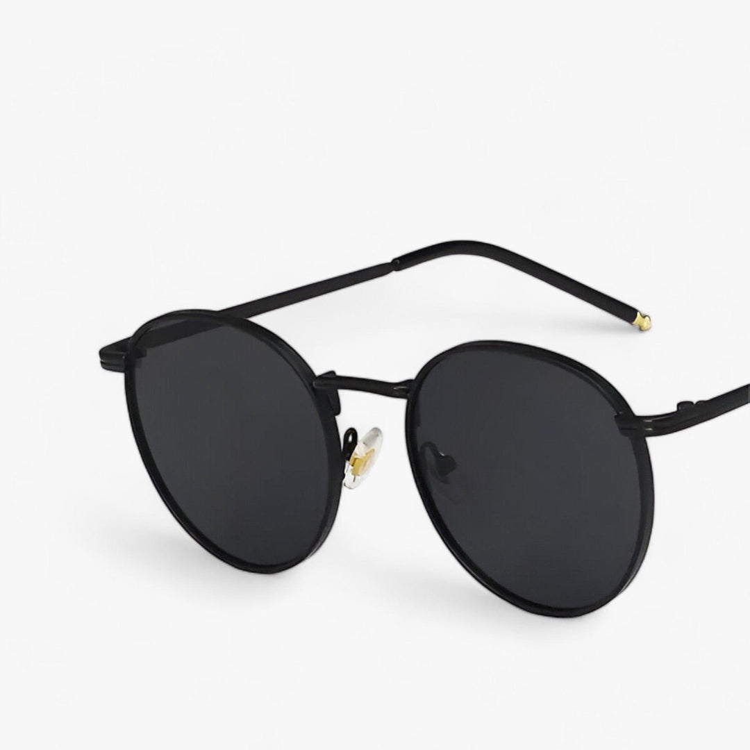 Nova unisex designer sunglasses, classic round lenses. Metal frame eyewear for fashion-conscious individuals.