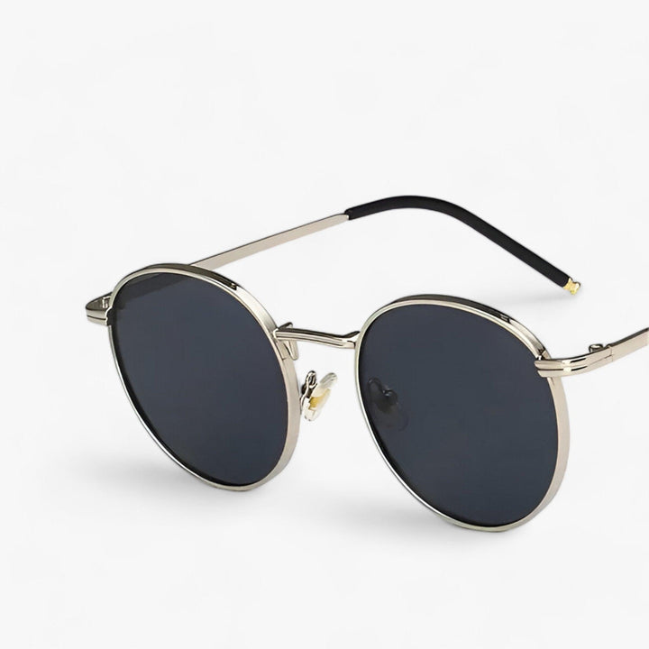 Stylish round lens unisex sunglasses for designer fashion. Offers excellent UV protection with a durable metal frame.