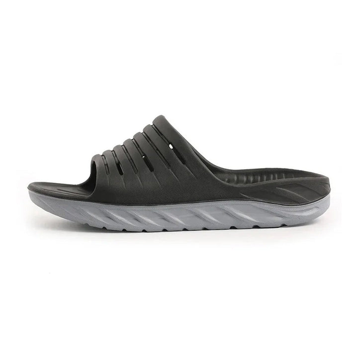 Unisex orthopedic comfort slides for arch & heel pain relief, ideal for plantar fasciitis recovery.