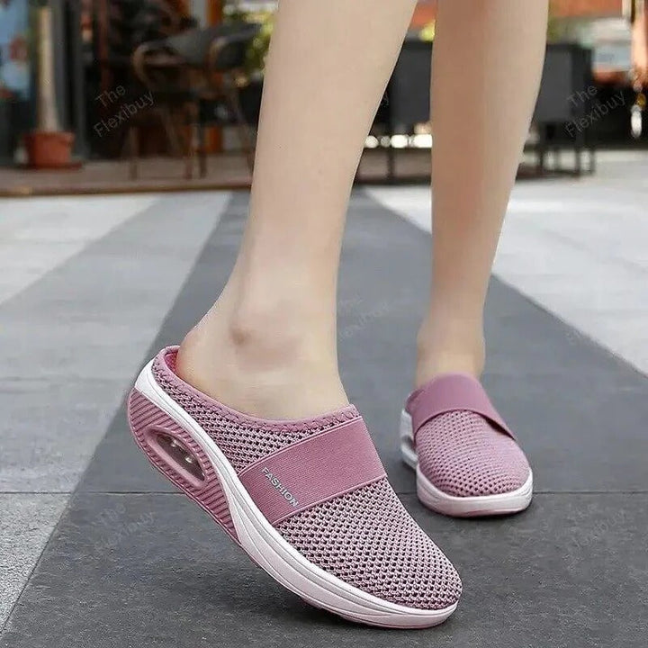 Breathable fabric unisex orthopedic slippers, offering comfort and support for daily wear. Lightweight slip-on design.