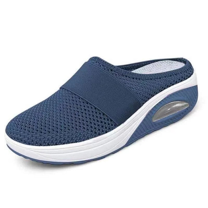 Unisex orthopedic comfort slippers, side view. Ergonomic design, lightweight, breathable, and provides foot pain relief.