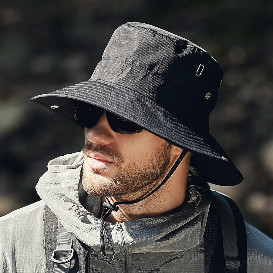 Unisex outdoor wide brim bucket hat for sun protection, in a neutral color, perfect for travel