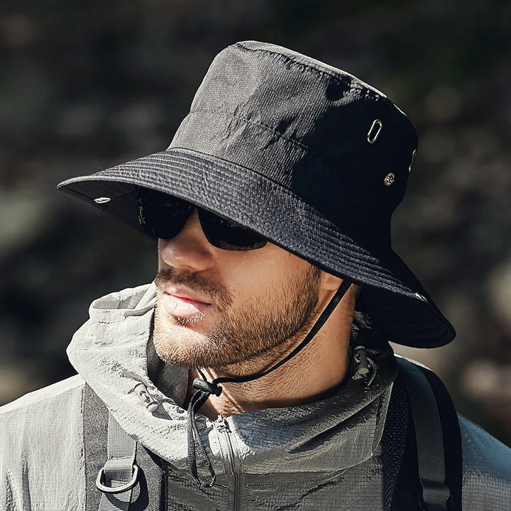 Unisex outdoor wide brim bucket hat for sun protection, in a neutral color, perfect for travel