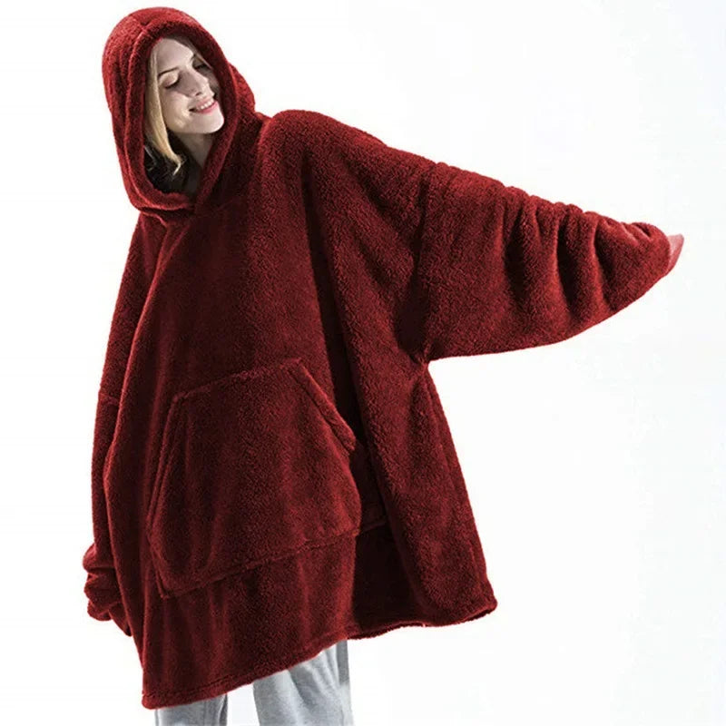 Unisex winter blanket hoodie with large pocket, providing cozy warmth and relaxation for all genders.