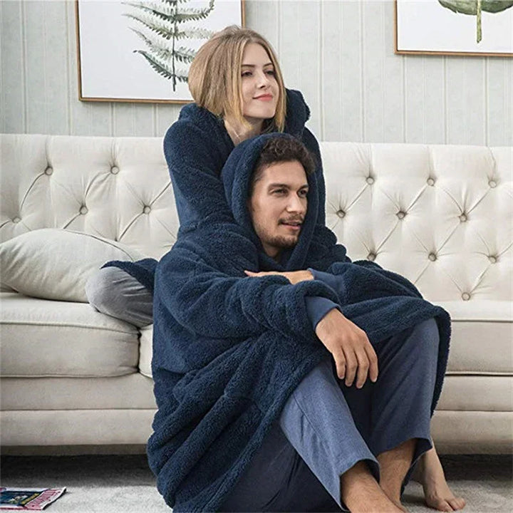 Oversized flannel hoodie, combining the comfort of a blanket with a cozy wearable sweatshirt.