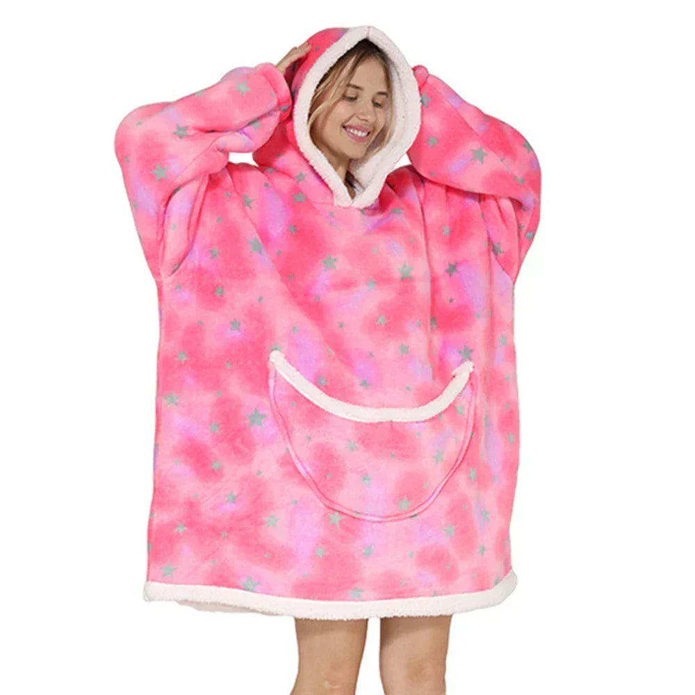 Snuggle up in this oversized wearable blanket, featuring a hood & pockets for warmth.