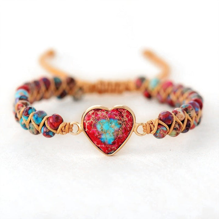 Artistic flat lay of a Unisex Passionate Heart Charm Bracelet, ideal spiritual gift