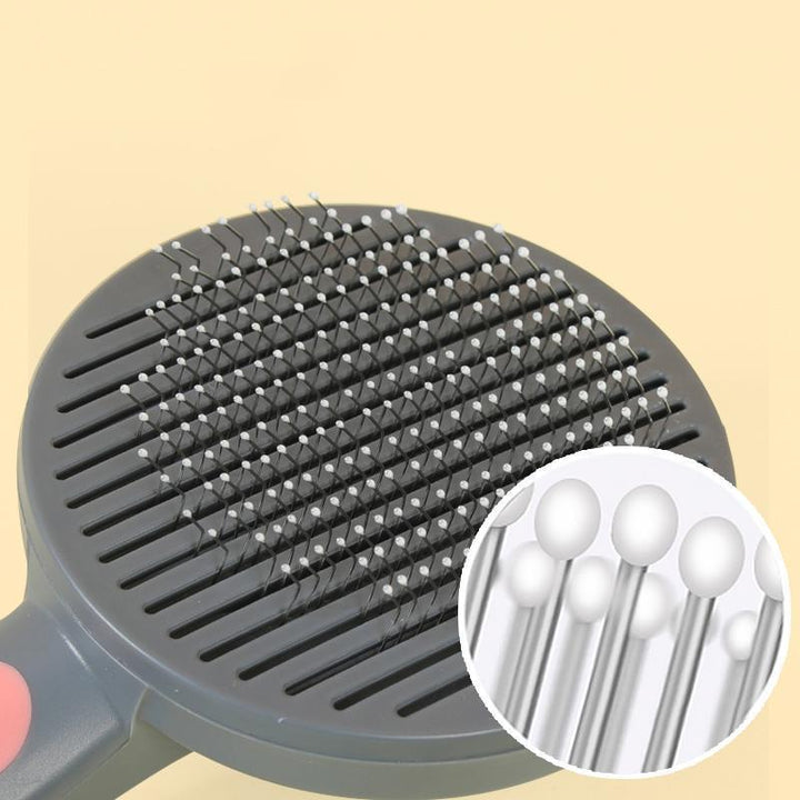 Ergonomic pet grooming brush with a comfortable grip, perfect for cat and dog owners