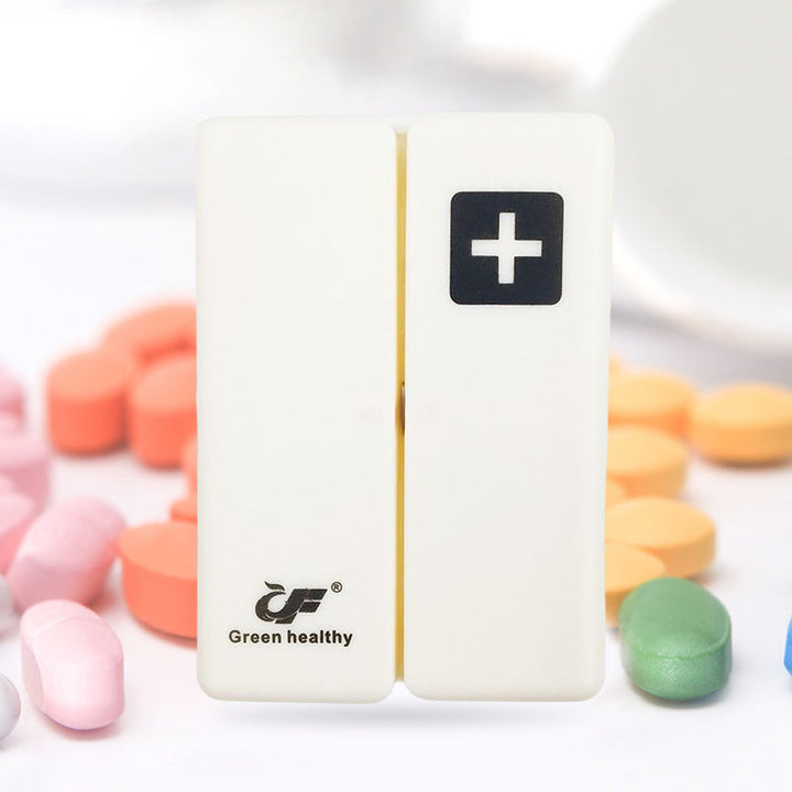 Open 7-day pill box revealing individual compartments, ready for daily and weekly pill organization