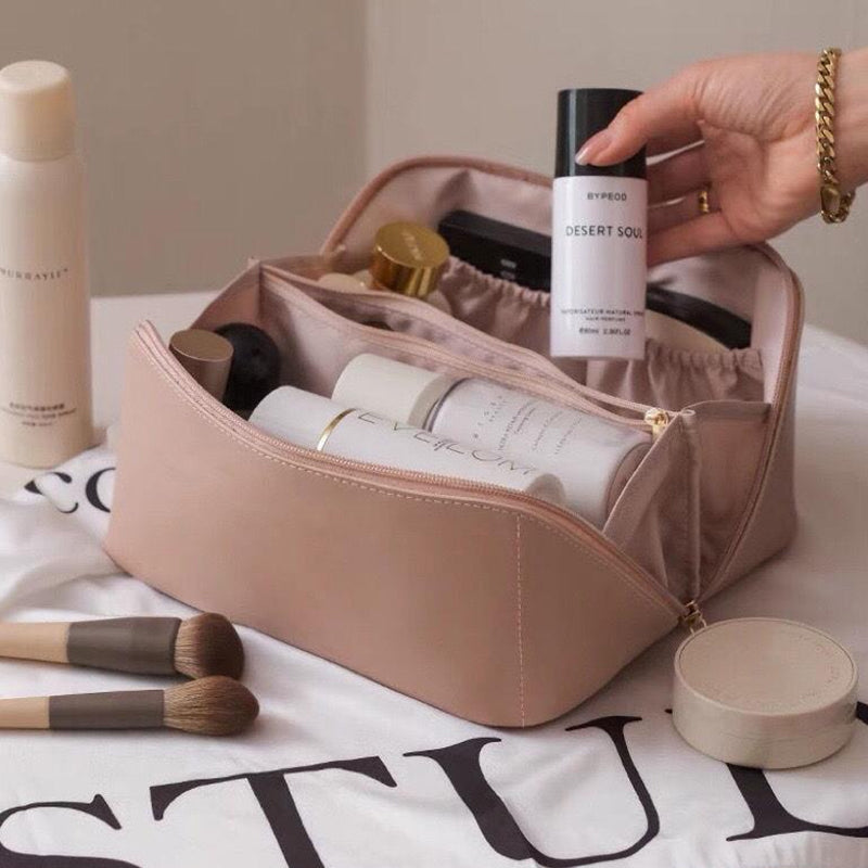 Unisex portable PU leather travel cosmetic organizer, waterproof storage for toiletries and makeup accessories.