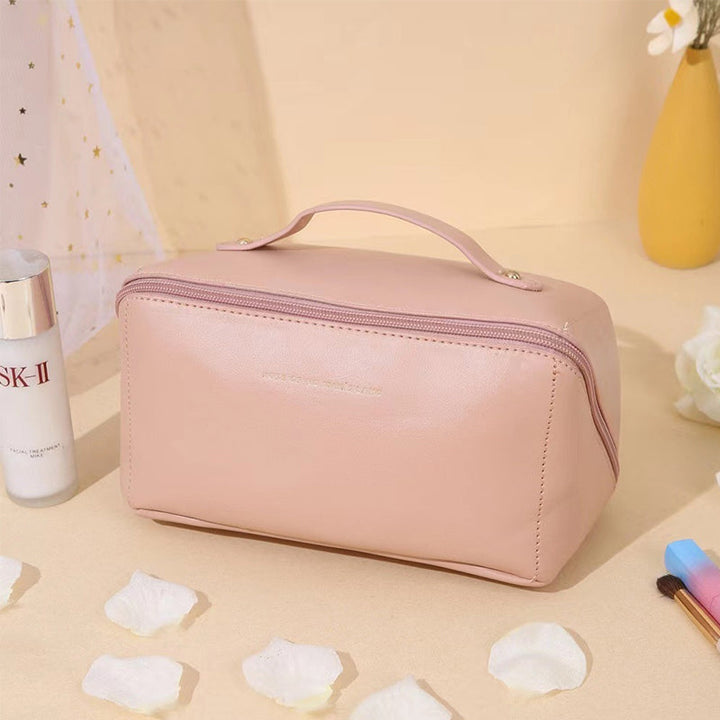 Empty unisex travel cosmetic bag, demonstrating its spacious interior for all beauty essentials.