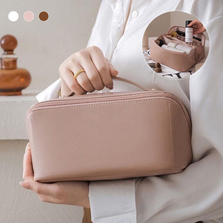 Waterproof travel cosmetic organizer with various makeup brushes and toiletries stored neatly inside.
