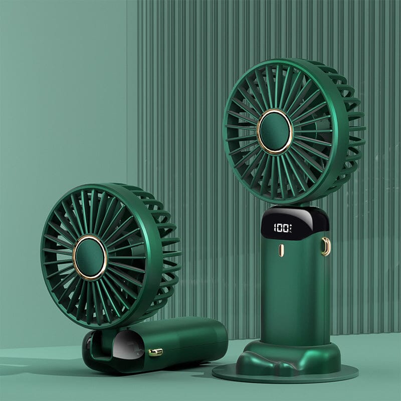 Compact personal fan next to a smartphone, emphasizing its small size and tech compatibility