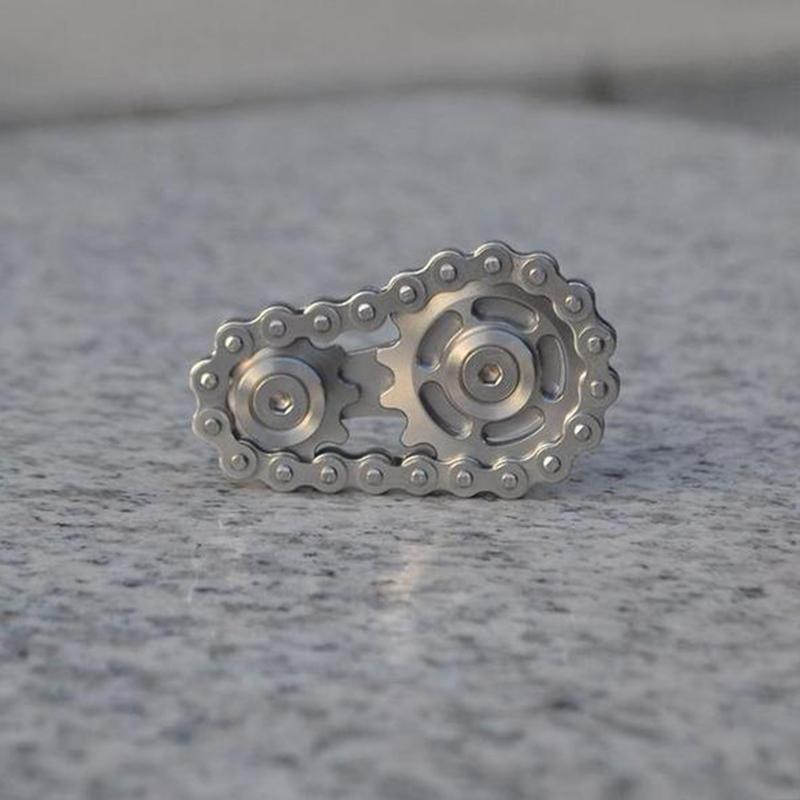 Collection of stainless steel fidget sprockets, highlighting their portable and robust design