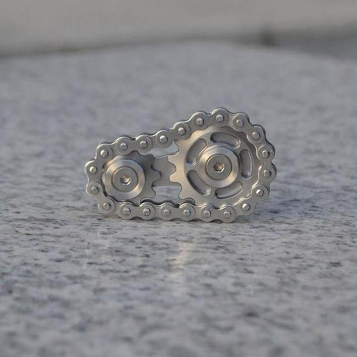 Collection of stainless steel fidget sprockets, highlighting their portable and robust design