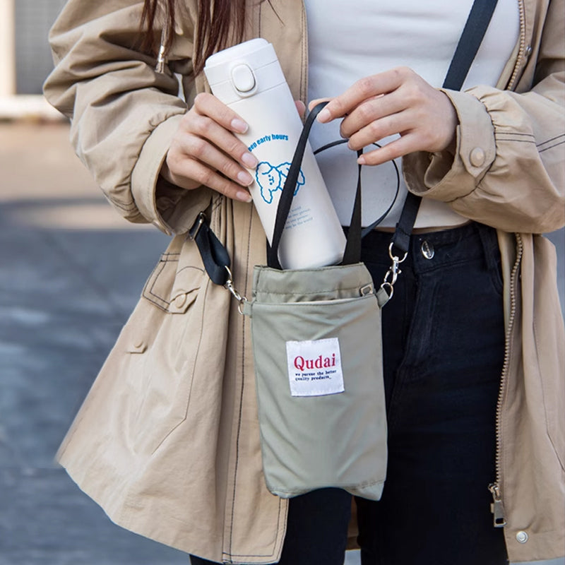 Unisex portable water bottle sling bag, sleek design in black PU leather, hydration solution.