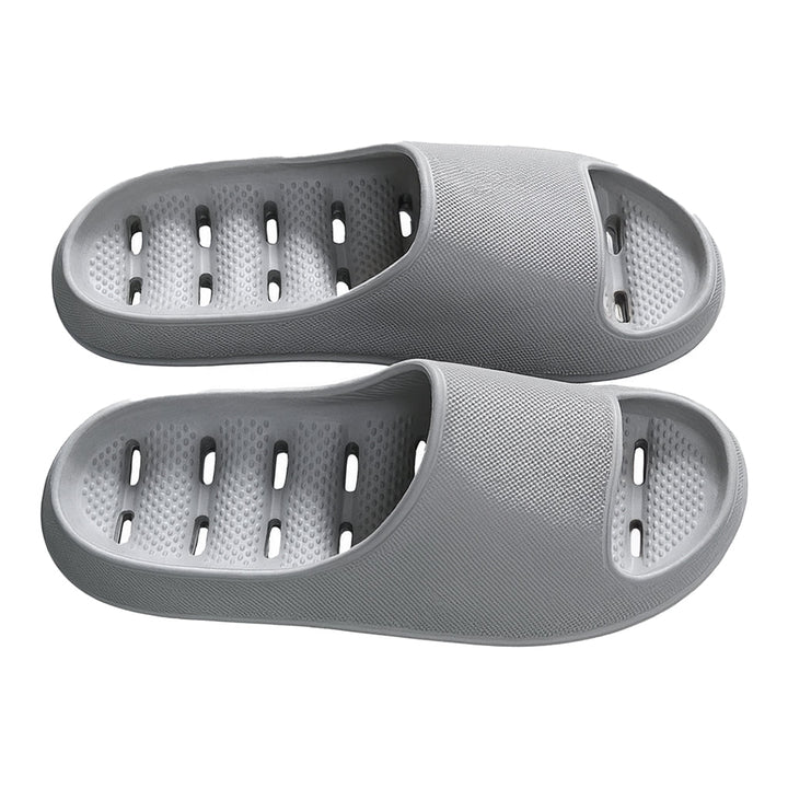 Close-up of quick-dry shower slippers showing effective drainage holes & waterproof design for wet environments.