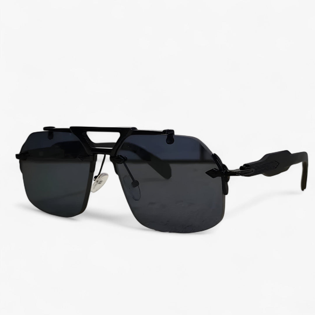 Chic oversized rimless sunglasses with striking gold metal accents. Mirrored lenses for a fashionable look.