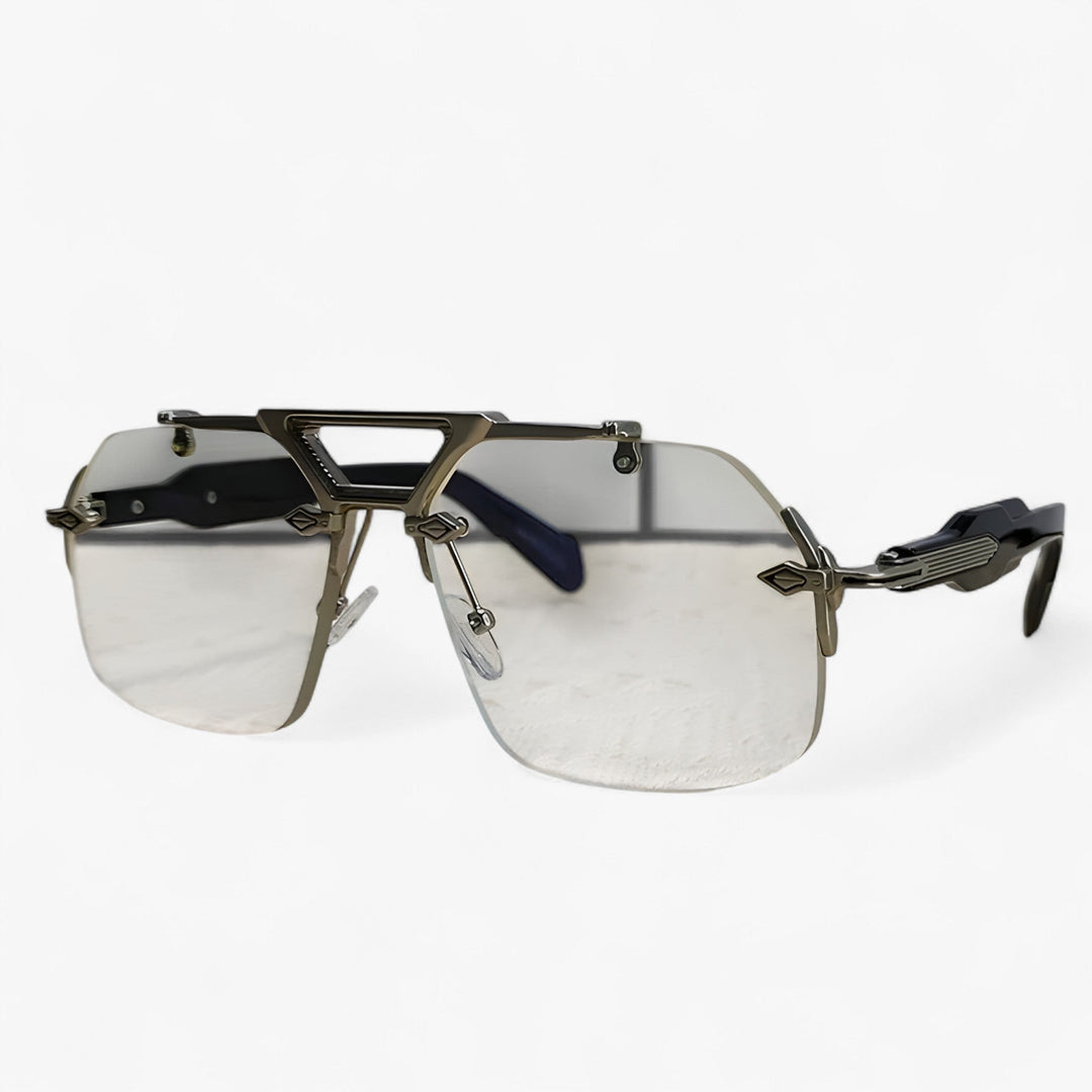 Unisex oversized rimless sunglasses with gray mirrored lenses, ideal for street style & fashion. Gold details.