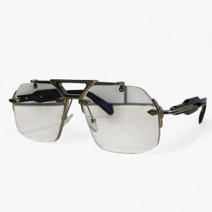 Unisex oversized rimless sunglasses with gray mirrored lenses, ideal for street style & fashion. Gold details.