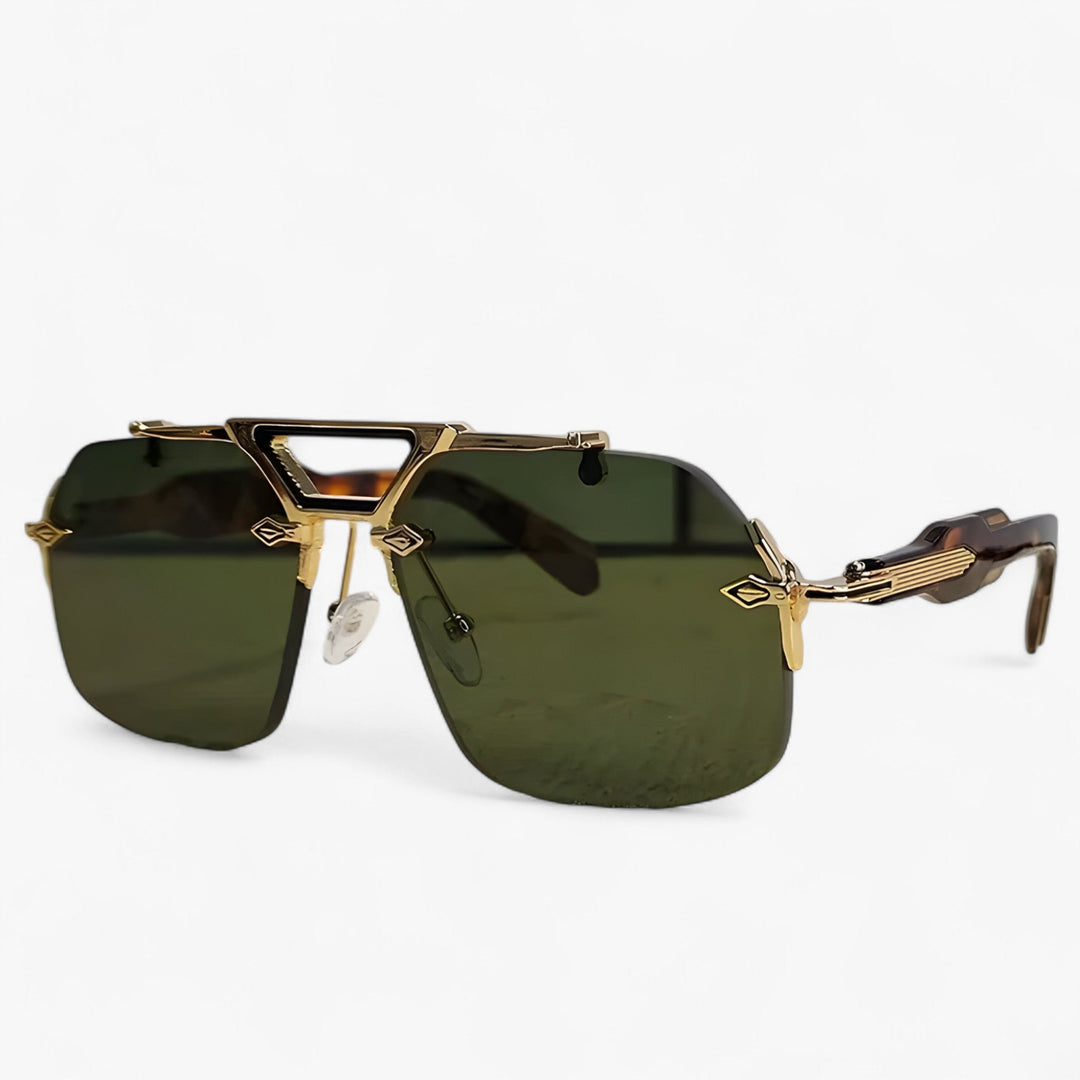 Elegant gray rimless oversized sunglasses. Featuring subtle gold metal accents and UV400 protection.
