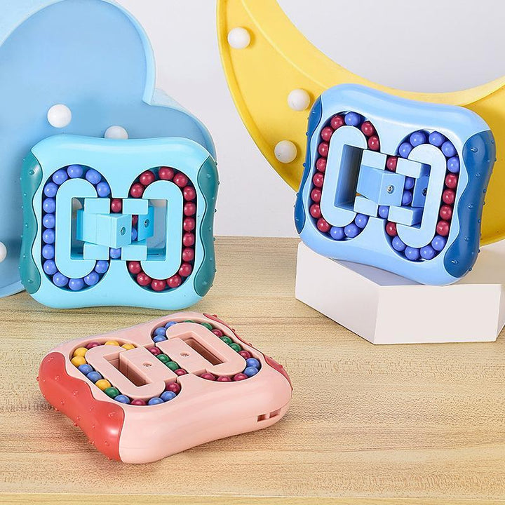 Close-up of a multi-colored rotating finger sensory cube, an educational fidget toy for all ages