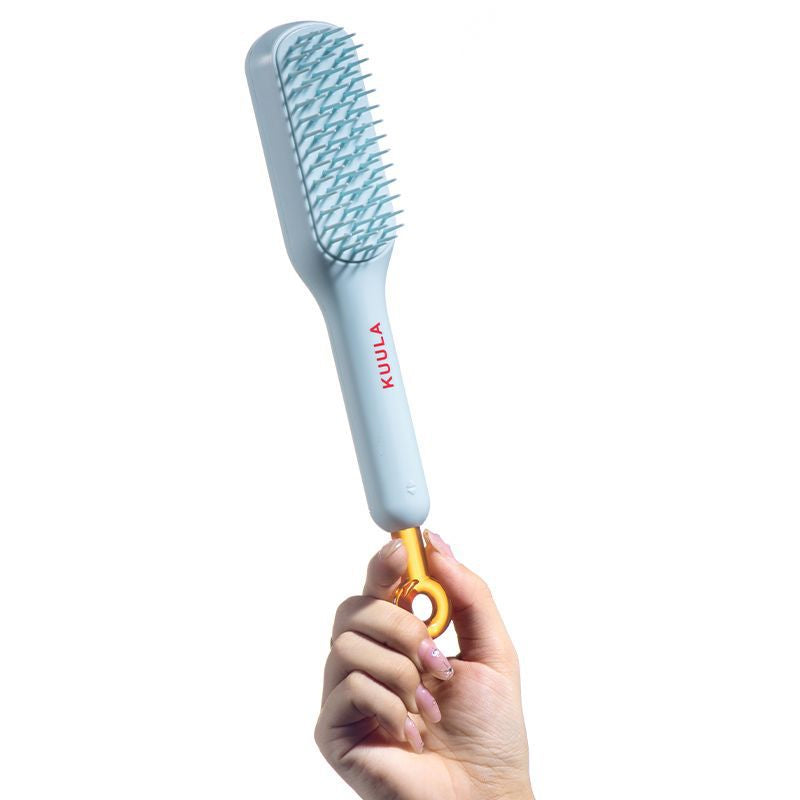 Collection of hair tools, featuring the versatile unisex self-cleaning anti-static hair brush