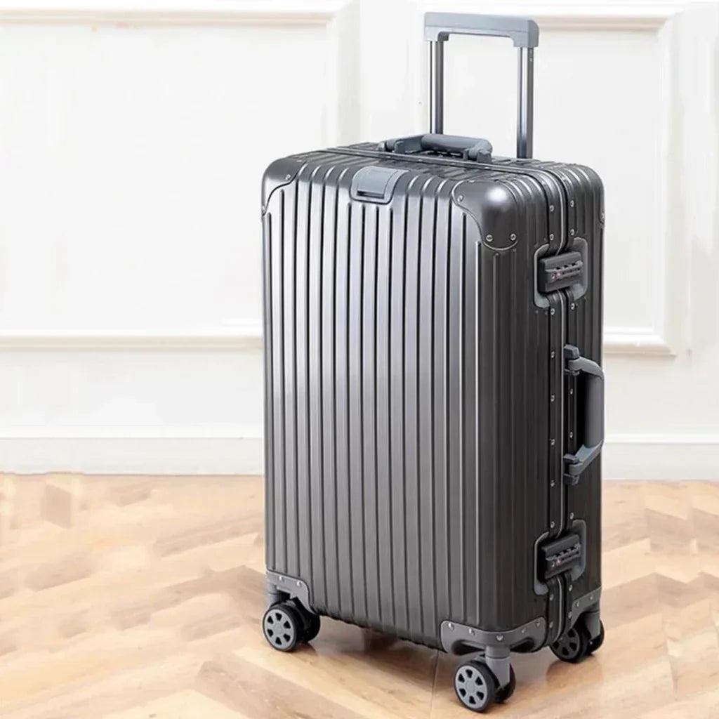 Unisex silver aluminum hard shell luggage with smooth spinner wheels for durable, secure travel.