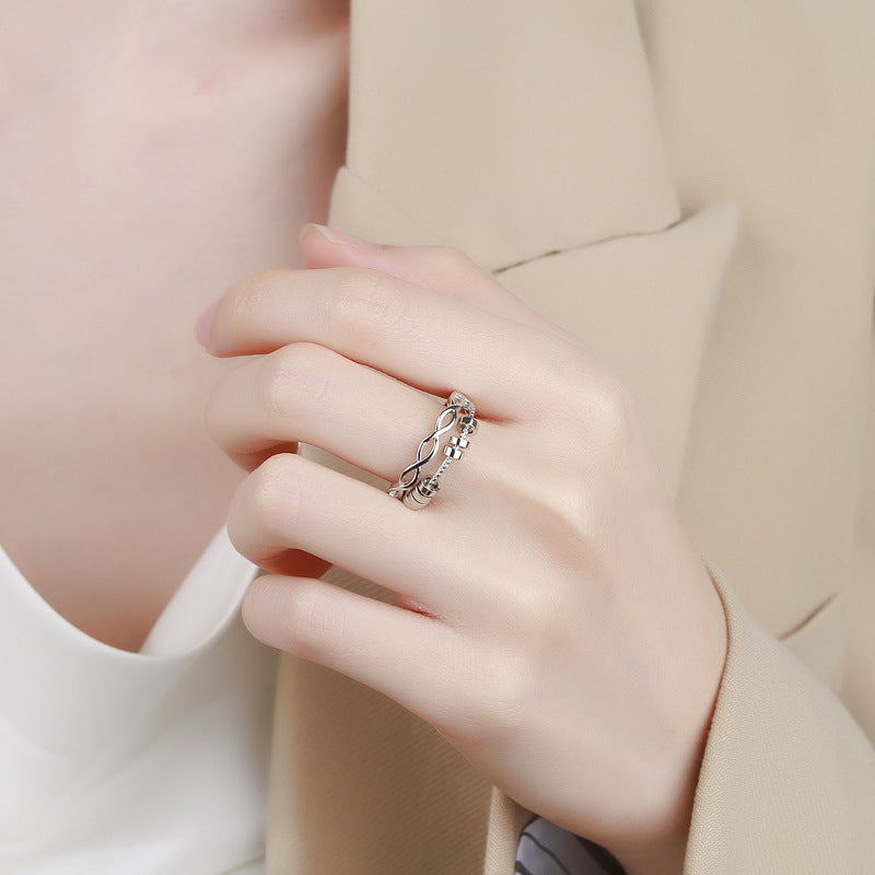 Silver adjustable infinity fidget ring, perfect for anxiety relief and daily wear, shown on a finger