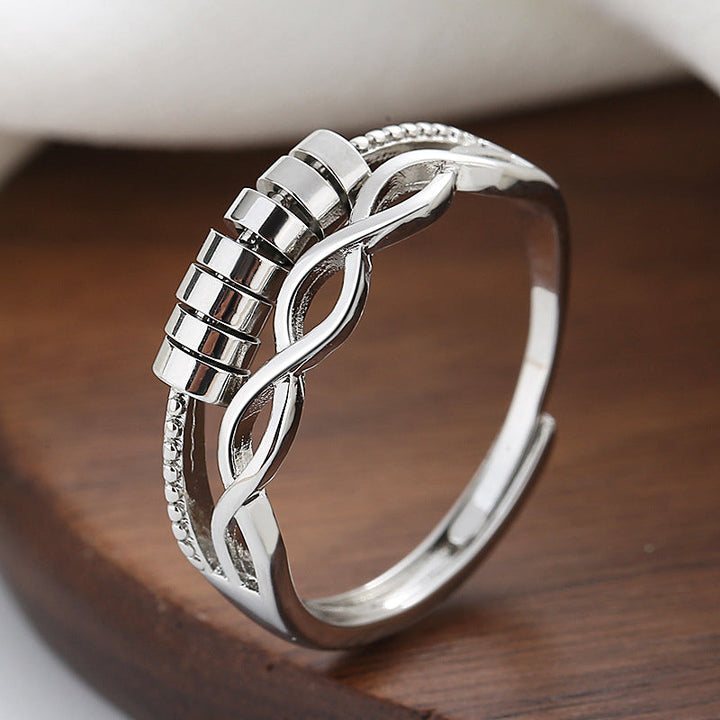 Fashionable silver infinity fidget ring, unisex design, provides anxiety relief, full product shot