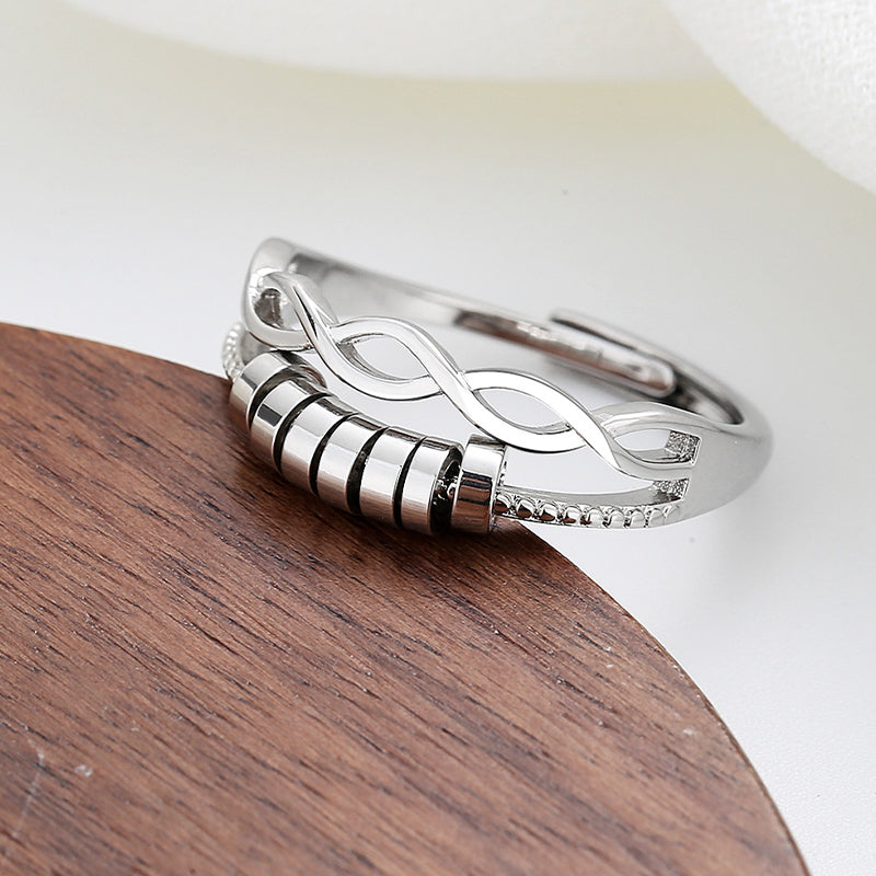 Gift box showcasing a silver adjustable infinity fidget ring, perfect for anxiety & stress relief