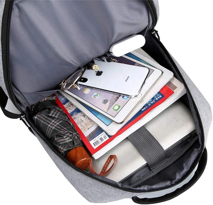 Stylish unisex slim backpack in grey worn by a commuter, showcasing its modern design and comfortable fit.