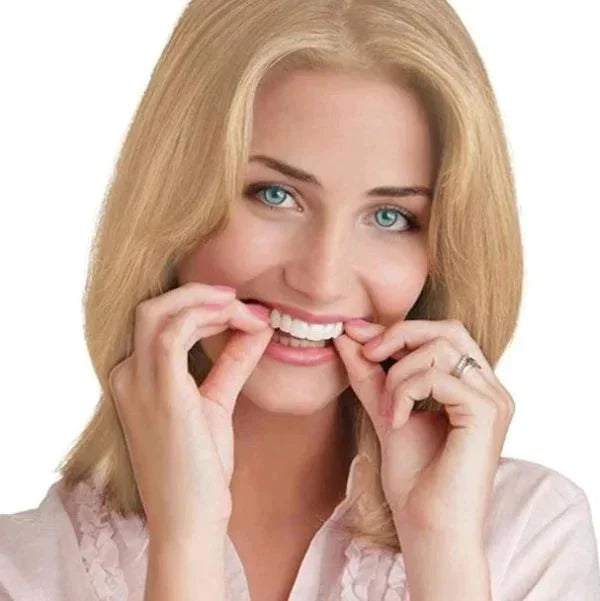 Hand displaying flexible, natural-fitting snap-on veneers for a perfect smile.