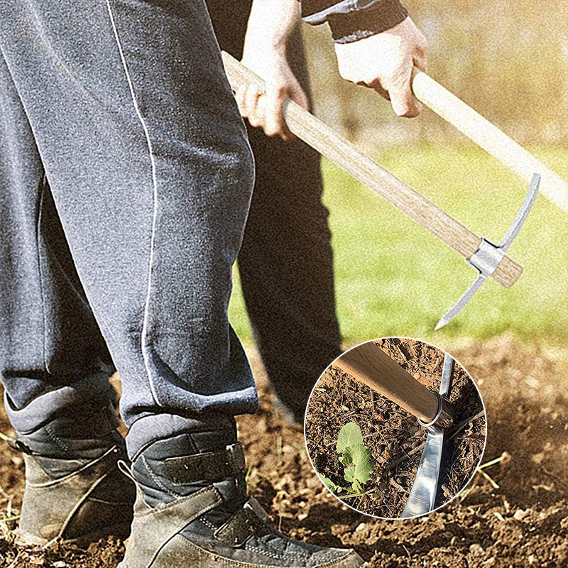 The full length of the pickaxe mattock resting on soil, demonstrating its practical size for various garden chores.