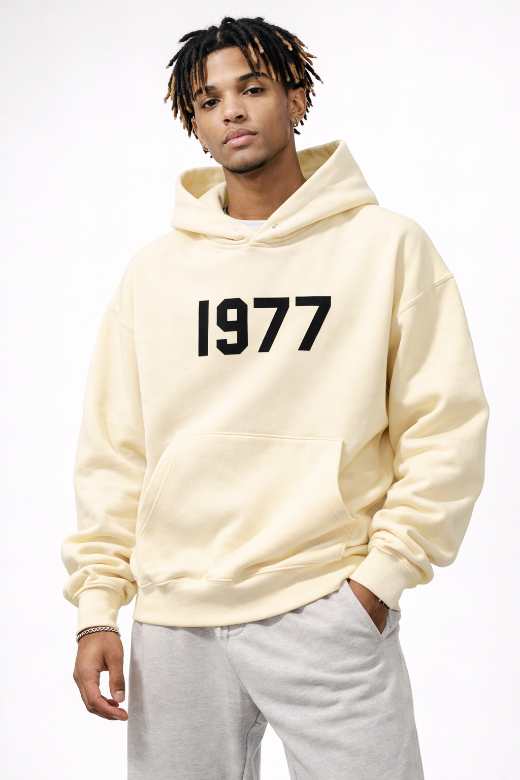 Vintage 1977 print unisex hoodie with raglan sleeves, ideal for retro street style.